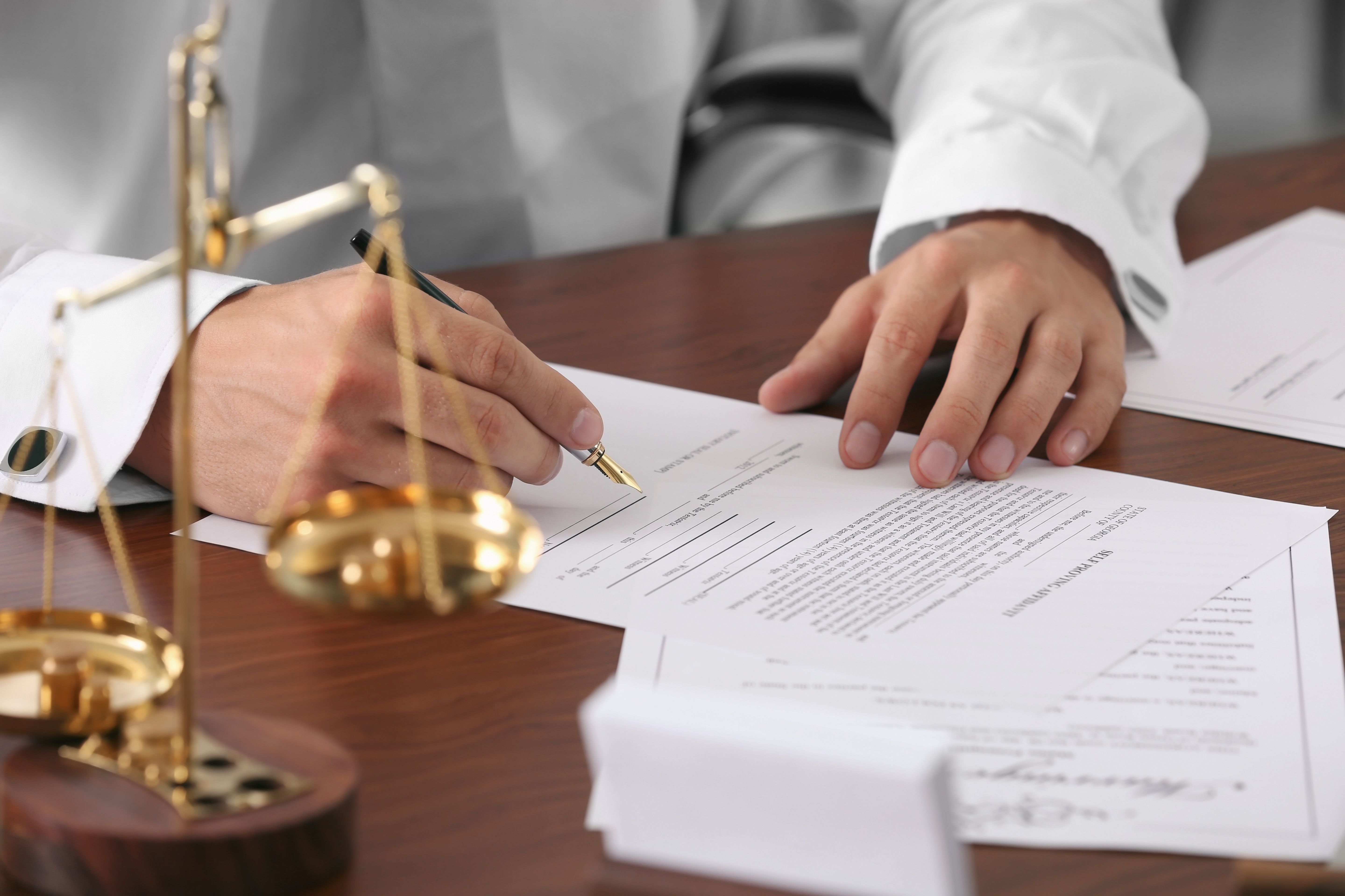 Man signing legal documents